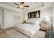 This spacious main bedroom features a ceiling fan, tray ceiling, and stylish decorations at 847 Pensive Run, Dacula, GA 30019