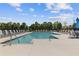 A sparkling pool with lounge chairs creates an inviting community space for relaxation at 847 Pensive Run, Dacula, GA 30019