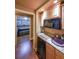 Granite countertop wet bar featuring a stainless-steel mini-fridge at 31 Vine Creek Ln, Acworth, GA 30101