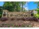 Stone entrance sign for Bentwater community with manicured landscaping and flowerbeds at 31 Vine Creek Ln, Acworth, GA 30101