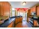 Well-equipped kitchen with stainless steel appliances, granite countertops, and wooden cabinetry at 31 Vine Creek Ln, Acworth, GA 30101