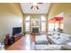 Bright living room with high ceilings, a stone fireplace, and large windows for natural light at 31 Vine Creek Ln, Acworth, GA 30101