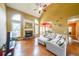 Spacious living room featuring hardwood floors, a fireplace, and comfortable seating at 31 Vine Creek Ln, Acworth, GA 30101