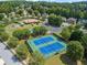 Aerial view of community tennis courts and recreation area with mature trees and playground at 31 Vine Creek Ln, Acworth, GA 30101