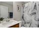 Bathroom with a sink, gray marble shower curtain, and a framed picture at 336 Elaina Cir, Locust Grove, GA 30248