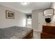 Bedroom with a wooden sleigh bed, matching dresser, carpeted flooring and natural light at 336 Elaina Cir, Locust Grove, GA 30248