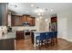 Modern kitchen with granite countertops, stainless steel appliances, and an island with bar seating at 336 Elaina Cir, Locust Grove, GA 30248