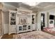 Spacious living room with a fireplace, built-in shelving, and coffered ceilings, perfect for relaxing at 336 Elaina Cir, Locust Grove, GA 30248