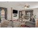 Cozy living room showcasing a fireplace, plush seating, and a serene ambiance enhanced by natural light at 336 Elaina Cir, Locust Grove, GA 30248