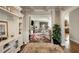 Open-concept living room showcasing built-in shelving and an easy flow to the kitchen and dining areas at 336 Elaina Cir, Locust Grove, GA 30248