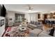 Comfortable living room with neutral tones, stylish curtains, and an open layout connecting to the kitchen at 336 Elaina Cir, Locust Grove, GA 30248