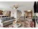 Bright and airy living room featuring a ceiling fan and seamless transitions to other living areas at 336 Elaina Cir, Locust Grove, GA 30248