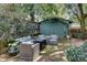 Backyard shed complemented with an outdoor living space and comfortable seating arrangements at 703 Cumberland Ne Cir, Atlanta, GA 30306