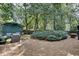 Relaxing backyard oasis featuring comfortable seating and a storage shed, creating a private retreat at 703 Cumberland Ne Cir, Atlanta, GA 30306