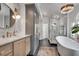 Luxurious bathroom with soaking tub, glass-enclosed shower, and modern fixtures at 703 Cumberland Ne Cir, Atlanta, GA 30306