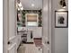 Charming bathroom with zebra wallpaper, patterned tile floor, and framed elephant art at 703 Cumberland Ne Cir, Atlanta, GA 30306
