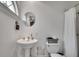 Bright bathroom with pedestal sink, white tile, and a walk in shower at 703 Cumberland Ne Cir, Atlanta, GA 30306