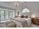 Bright bedroom with large bed, balcony access, and ample natural light at 703 Cumberland Ne Cir, Atlanta, GA 30306