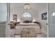 Airy bedroom with large window, chandelier, and neutral decor at 703 Cumberland Ne Cir, Atlanta, GA 30306