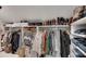 Spacious walk-in closet with custom shelving, hanging rods, and ample storage for clothing and accessories at 703 Cumberland Ne Cir, Atlanta, GA 30306