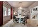 Elegant dining room featuring a chandelier, hardwood floors, and ample natural light at 703 Cumberland Ne Cir, Atlanta, GA 30306