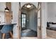 Elegant foyer with tile flooring, a view of the front door, and arched doorways at 703 Cumberland Ne Cir, Atlanta, GA 30306