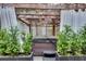 Outdoor hot tub enclosed in a pergola with curtains and manicured shrubs for added privacy at 703 Cumberland Ne Cir, Atlanta, GA 30306