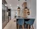Open kitchen with dark cabinets, stainless appliances, and breakfast bar seating at 703 Cumberland Ne Cir, Atlanta, GA 30306