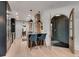Bright kitchen with hardwood floors, an island with seating, and a view to the front entrance at 703 Cumberland Ne Cir, Atlanta, GA 30306