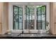 A modern kitchen sink featuring a large window overlooking a charming outdoor space and garden at 703 Cumberland Ne Cir, Atlanta, GA 30306