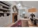 Bright living room with fireplace, built-in shelves, skylight, and doorway to bedroom at 703 Cumberland Ne Cir, Atlanta, GA 30306