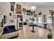 Spacious living room featuring an array of art, hardwood floors, and a grand staircase at 703 Cumberland Ne Cir, Atlanta, GA 30306