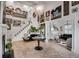 Open concept living room showcasing high ceilings, a grand staircase, and seamless flow to other rooms at 703 Cumberland Ne Cir, Atlanta, GA 30306