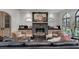 Inviting living room featuring a stone fireplace and built-in window benches with arched windows at 703 Cumberland Ne Cir, Atlanta, GA 30306