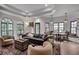 Open-concept living area with elegant furnishings and large windows, offering plenty of light at 703 Cumberland Ne Cir, Atlanta, GA 30306