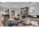 Cozy living room with a stone fireplace and built-in benches and open access to kitchen at 703 Cumberland Ne Cir, Atlanta, GA 30306