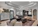 Open concept living room featuring stylish decor, hardwood floors, and ample natural light at 703 Cumberland Ne Cir, Atlanta, GA 30306