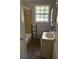 Bathroom featuring a shower/tub combo, window and cabinet at 865 Cherrydale Ln, Woodstock, GA 30189