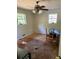 Bedroom featuring two windows and a ceiling fan at 865 Cherrydale Ln, Woodstock, GA 30189