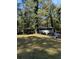 View of the exterior of the home with large front yard at 865 Cherrydale Ln, Woodstock, GA 30189