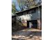 Exterior view with a brick base and a black garage door at 865 Cherrydale Ln, Woodstock, GA 30189