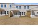 Backyard with private patio, small yard, and views of the adjacent properties at 936 Elwood St, Dacula, GA 30019
