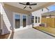 Private back patio with double doors, an outdoor fan, and plenty of space for outdoor seating at 936 Elwood St, Dacula, GA 30019