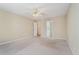 Bedroom with neutral walls features a ceiling fan and a doorway with an ensuite at 206 Towler Dr, Loganville, GA 30052
