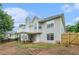 Exterior shot of a home with a deck, showcasing the backyard and surrounding foliage at 206 Towler Dr, Loganville, GA 30052