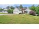 Attractive one-story home with an attached garage and a lush green lawn at 206 Towler Dr, Loganville, GA 30052