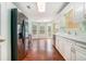 Well-appointed kitchen featuring white cabinets, sleek appliances, and hardwood floors at 206 Towler Dr, Loganville, GA 30052