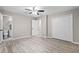 Bedroom features hardwood floors, a ceiling fan, and a walk-in closet at 2617 Peggy Sue Ln, Morrow, GA 30260