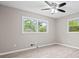 Bright bedroom features hardwood floors and two windows for natural light at 2617 Peggy Sue Ln, Morrow, GA 30260