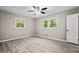 Bedroom featuring hard surface floors, ceiling fan, and natural light at 2617 Peggy Sue Ln, Morrow, GA 30260